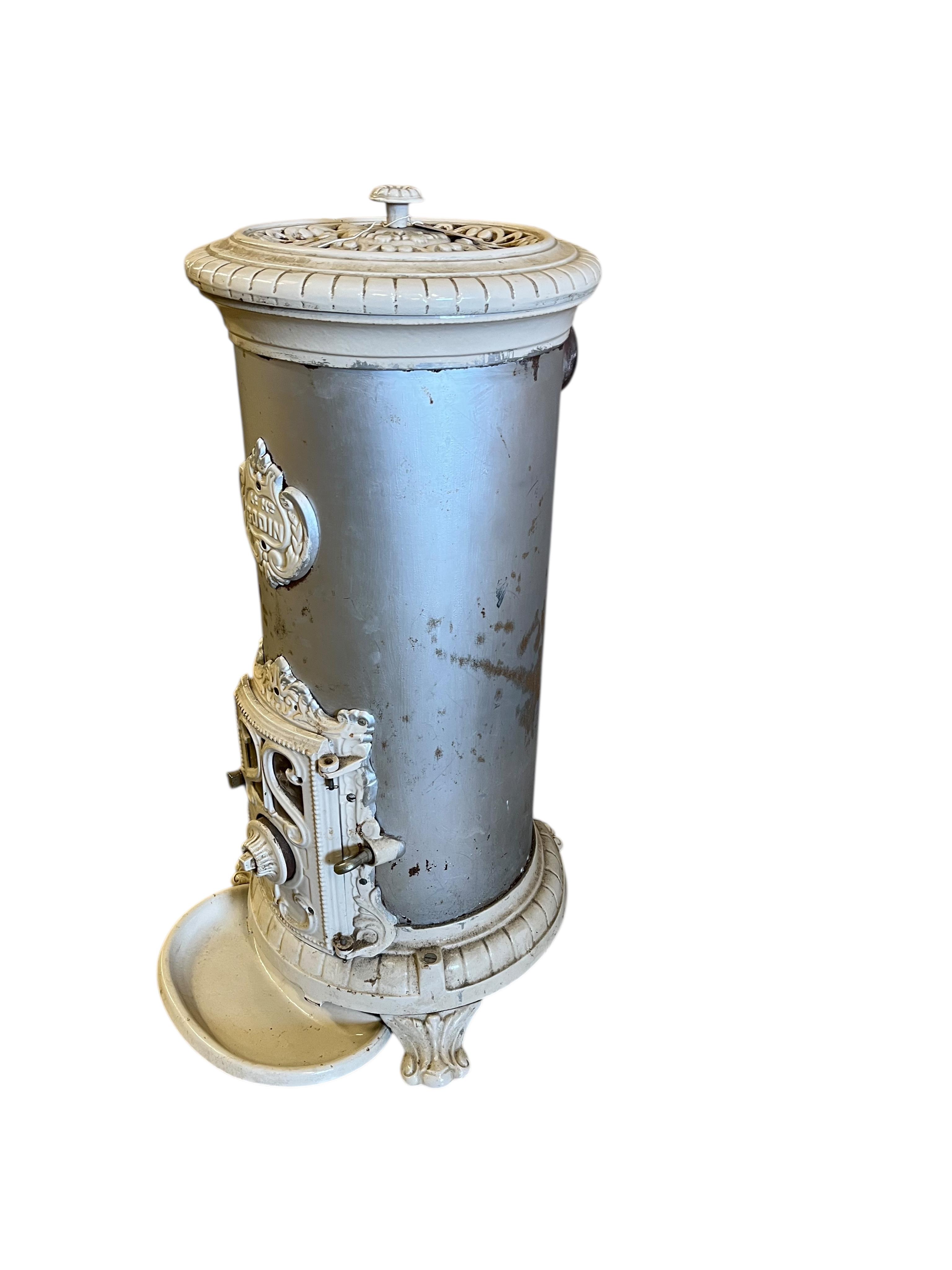 A 19th century French Godin cast iron stove, height 96cm